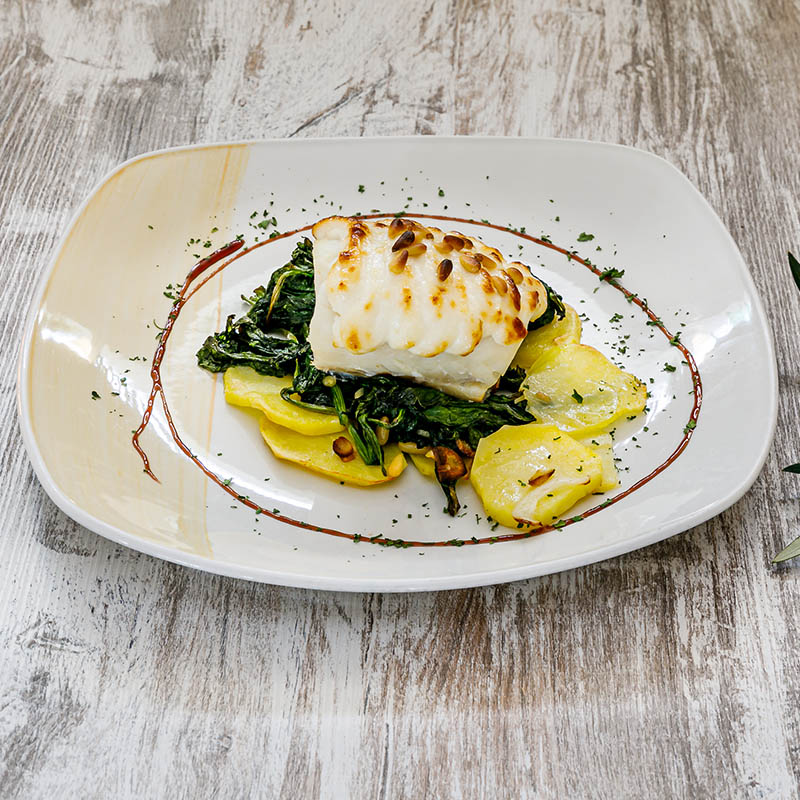 Cod au gratin with Alioli on a bed of Spinach